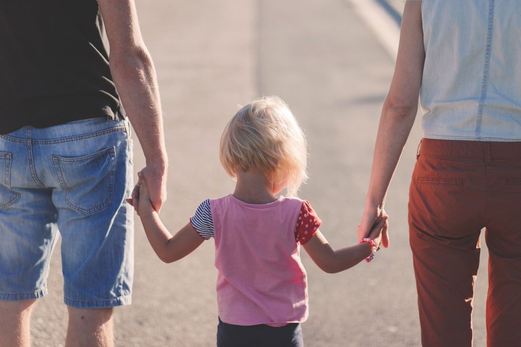 family holding hands parents child 1866868